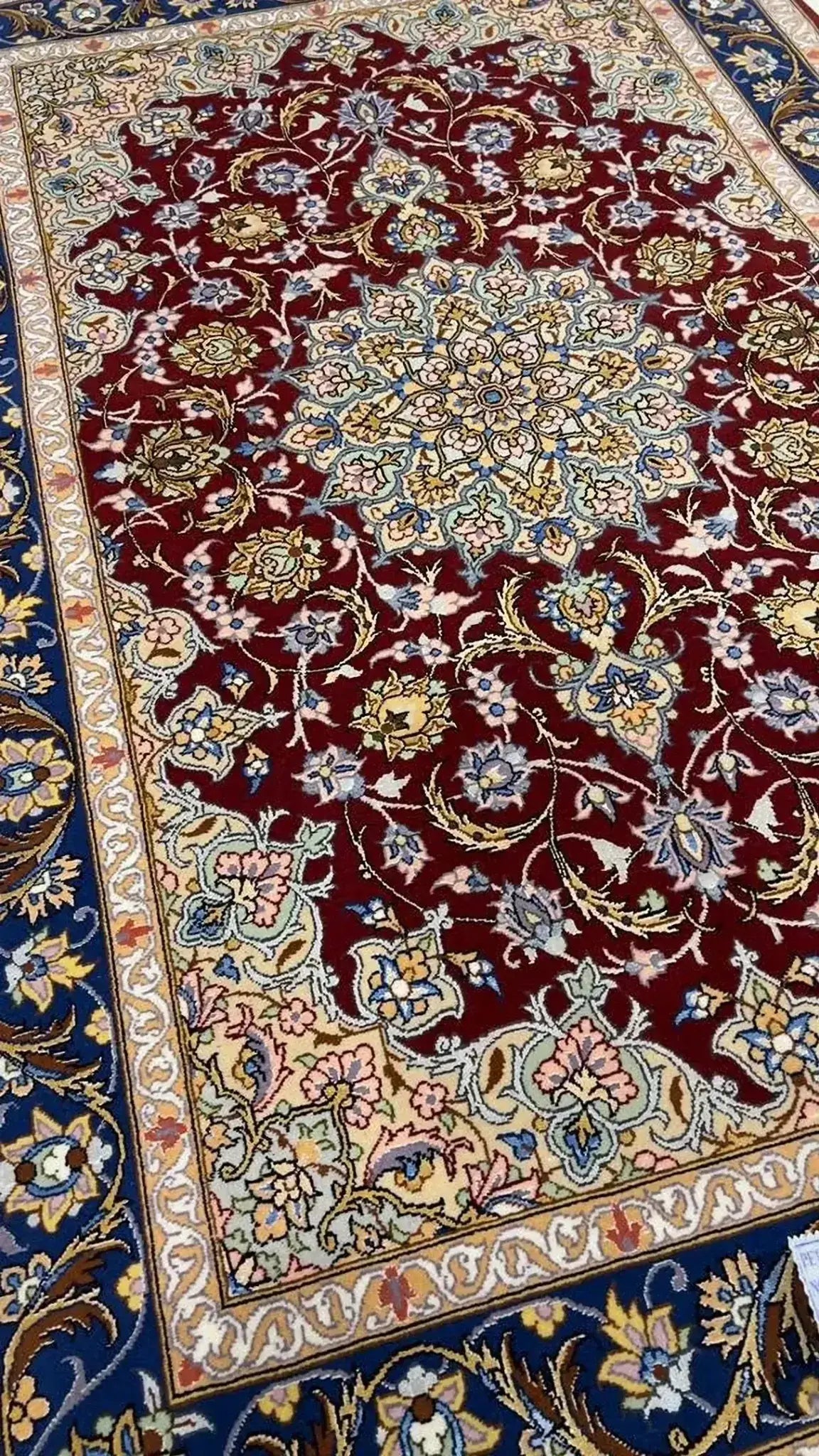 Luxury Isfahan Persian rug featuring a rich dark red color, made with a blend of wool and silk, hand-knotted with exceptional craftsmanship.